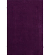 Solid purple hand-tufted wool rug with embossed rectangle